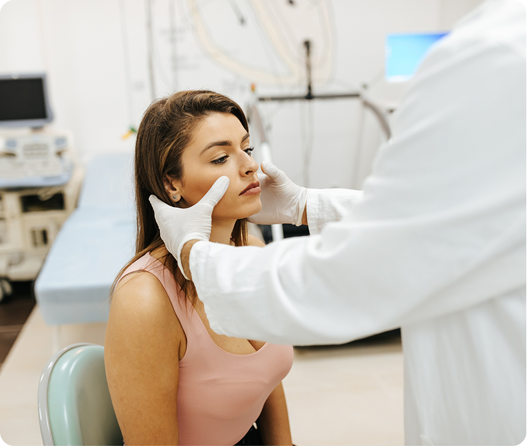 Dermatologist examining patient's skin